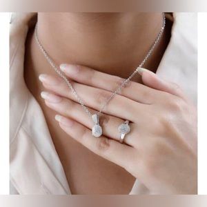 Karis diamond accent ring size 7. Pendant in platinum bond with stainless steel